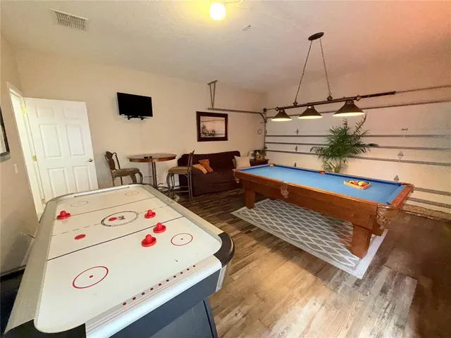 a very nice looking dining room with a table and chairs
