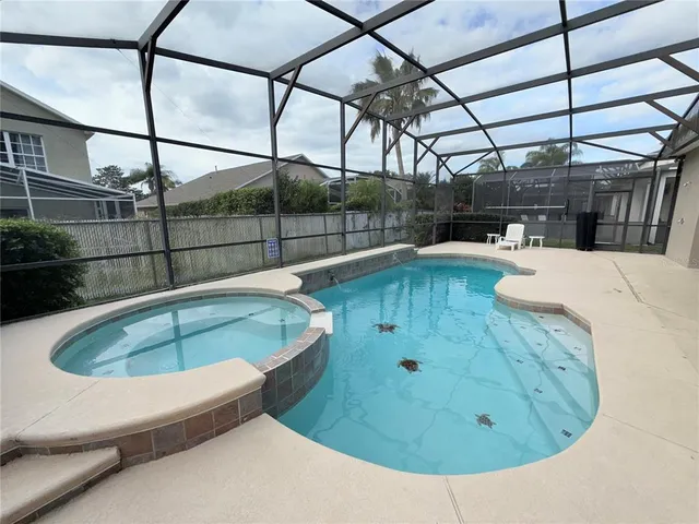 a view of a swimming pool with a porch