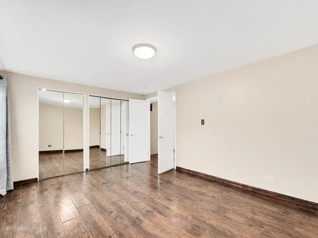 an empty room with wooden floor