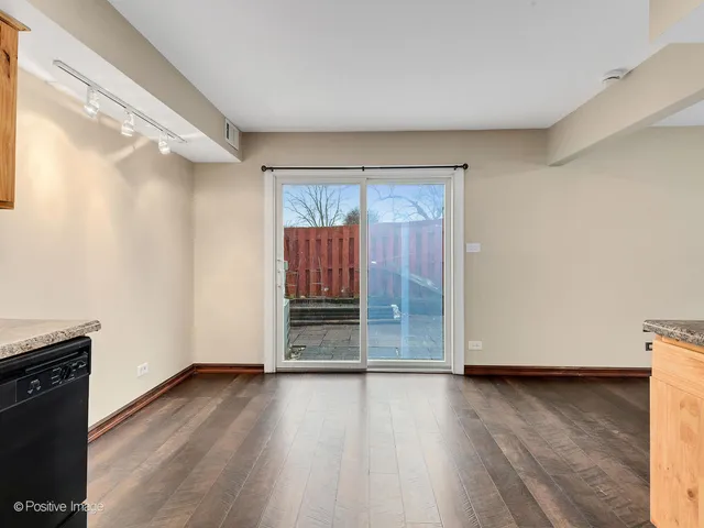 a view of wooden floor and brick walls