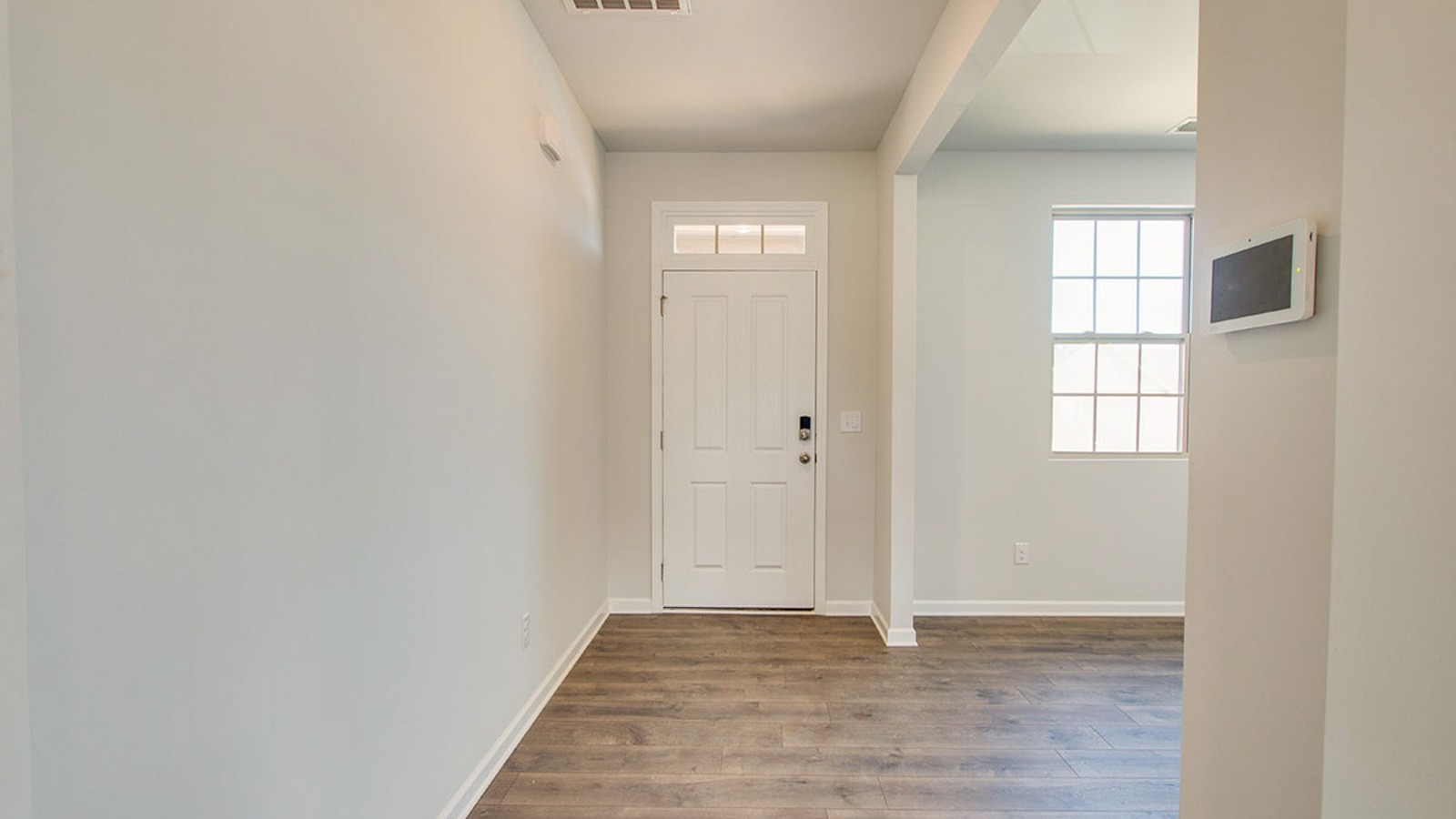 5448 Mason Way Cookeville, TN 38506 - Photo 2 of 30 a view of an empty room with wooden floor and window