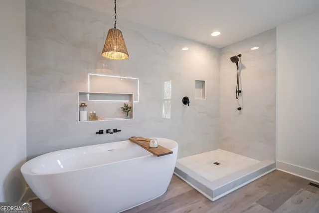 a bathroom with a granite countertop toilet and a sink
