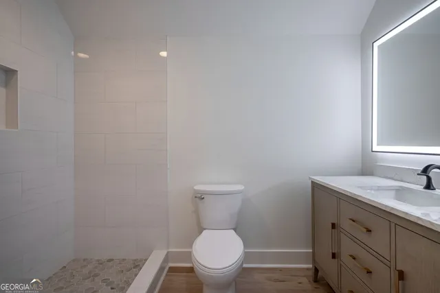 a bathroom with a tub sink and mirror