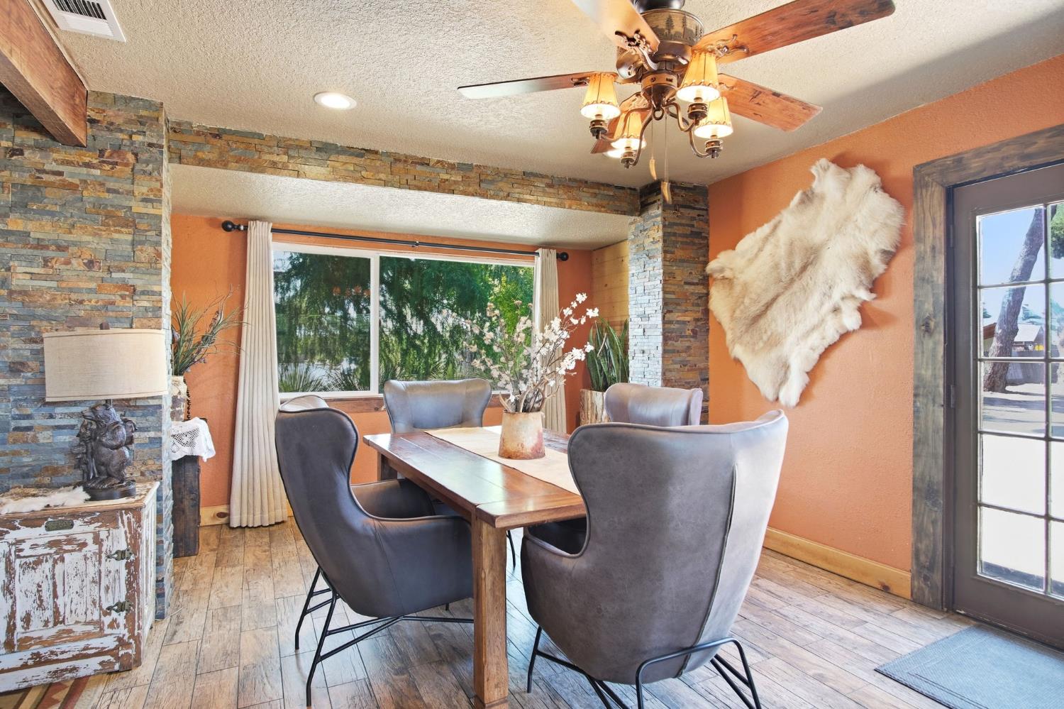 5200 North Gratton Road Denair, CA 95316 - Photo 4 of 40 a view of a dining room with furniture window and wooden floor