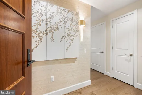a kitchen with stainless steel appliances granite countertop a sink refrigerator and cabinets