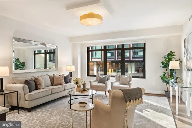 a living room with furniture and a large window