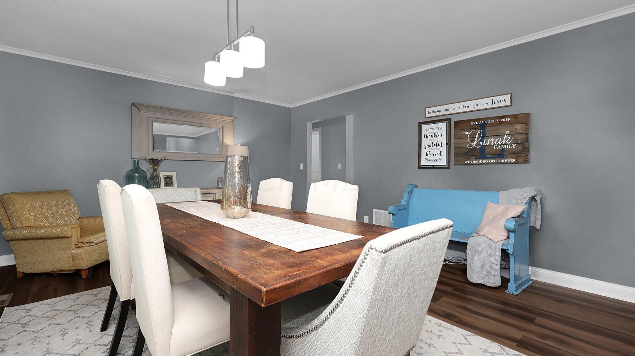 7790 Schott Road Westerville, OH 43081 - Photo 6 of 50 Upon entry, you'll be welcome into the beautiful dining room with LVP flooring, upgraded light fixture and space to host the biggest of family events!