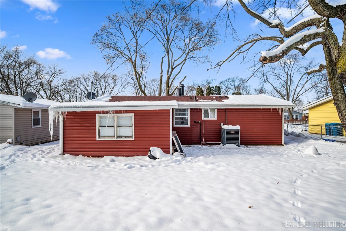 1009 Assell Avenue Aurora, IL 60505 - Photo 22 of 24 a view of a house with a yard and garage