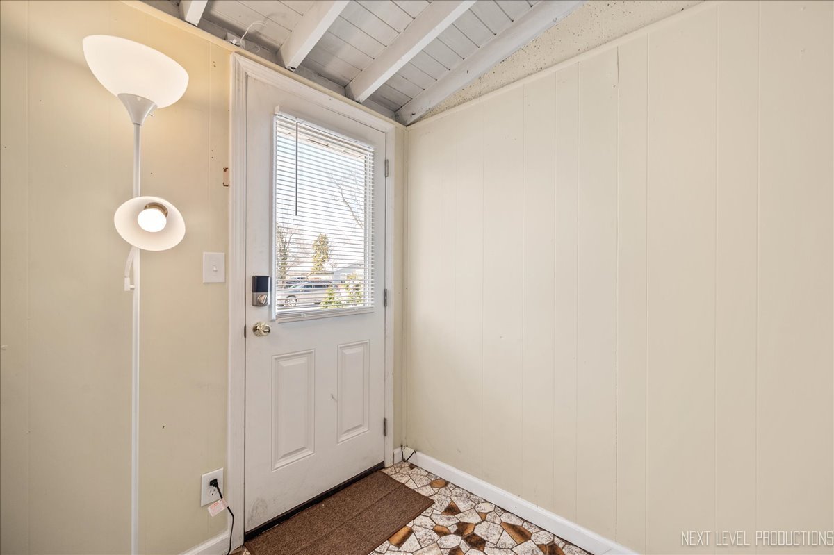 1009 Assell Avenue Aurora, IL 60505 - Photo 6 of 24 a view of bathroom with a sink and mirror
