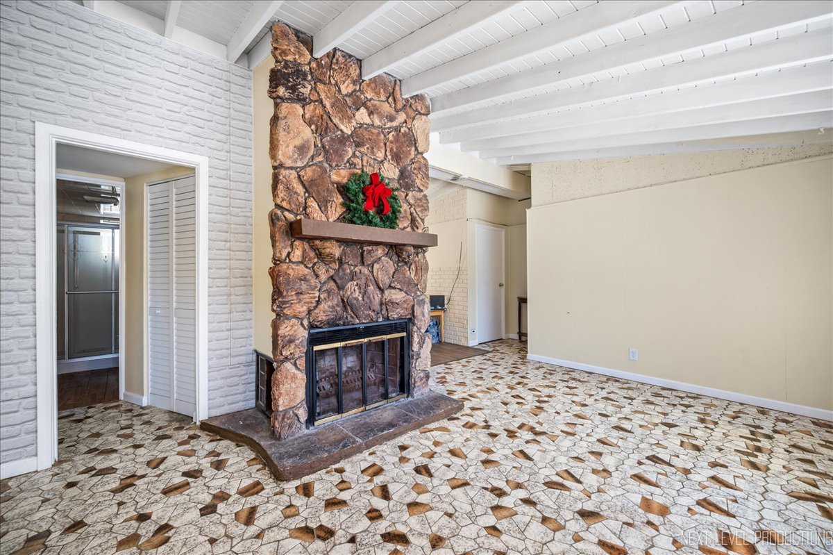 1009 Assell Avenue Aurora, IL 60505 - Photo 7 of 24 a very nice looking room with a fireplace and a chandelier