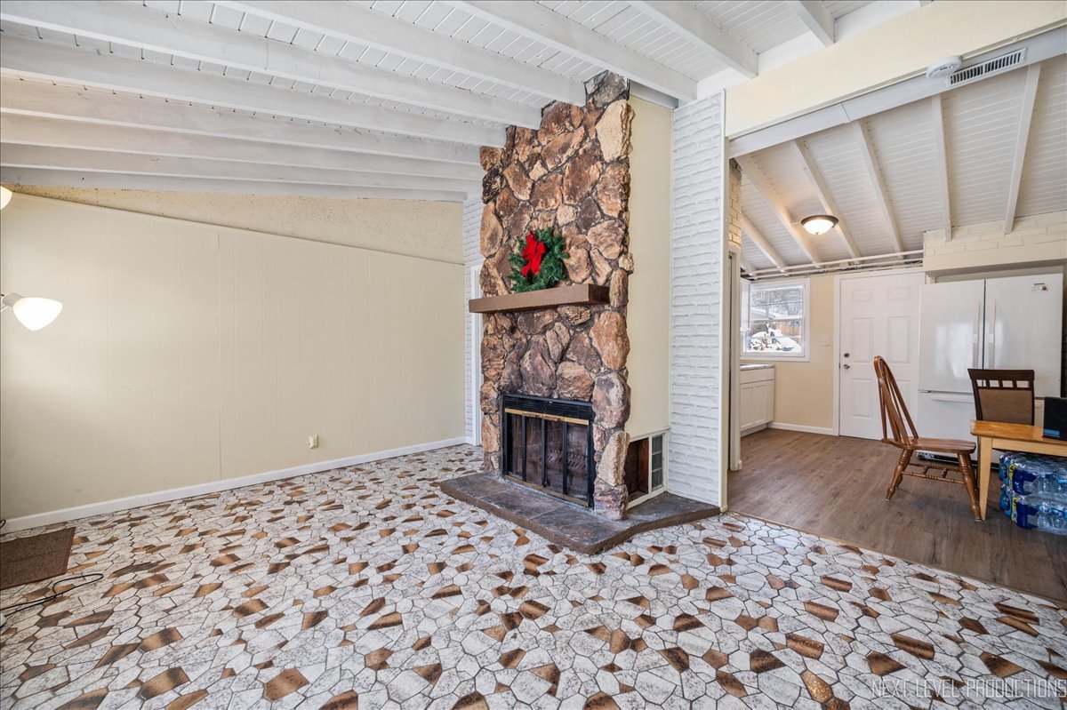 1009 Assell Avenue Aurora, IL 60505 - Photo 8 of 24 a bedroom with a bed and a couch