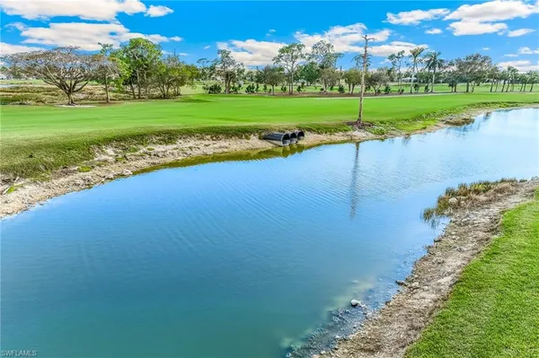 a view of a golf course with a lake