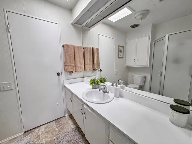 a kitchen with a sink and a refrigerator
