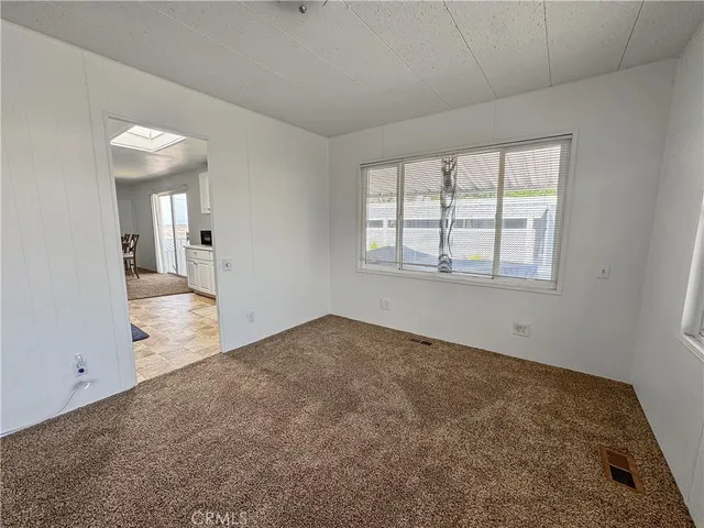 a view of an empty room and window