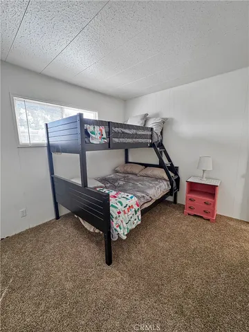 a bedroom with furniture and window