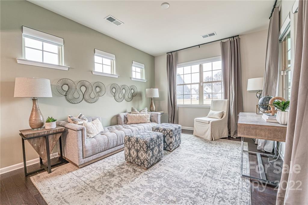 3196 Windhaven Lane, Unit 112 Tega Cay, SC 29708 - Photo 14 of 26 a living room with furniture and a window