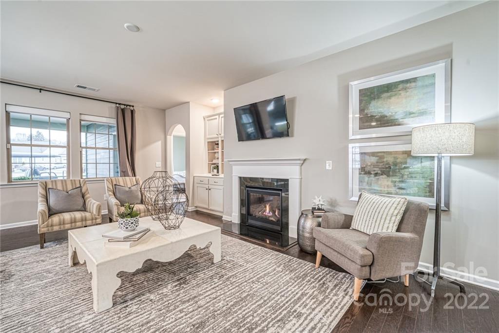 3196 Windhaven Lane, Unit 112 Tega Cay, SC 29708 - Photo 17 of 26 a living room with furniture and a fireplace