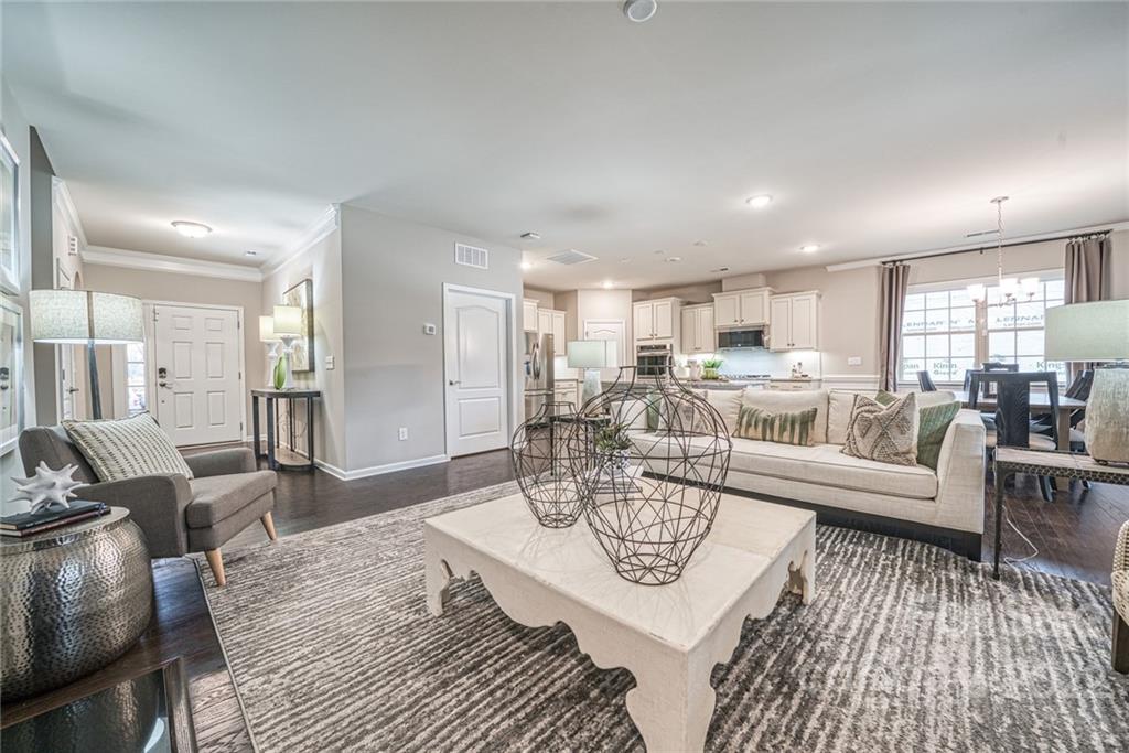3196 Windhaven Lane, Unit 112 Tega Cay, SC 29708 - Photo 5 of 26 a living room with lots of furniture and view of kitchen