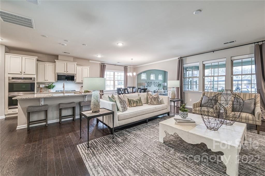 3196 Windhaven Lane, Unit 112 Tega Cay, SC 29708 - Photo 6 of 26 a living room with furniture and a wooden floor