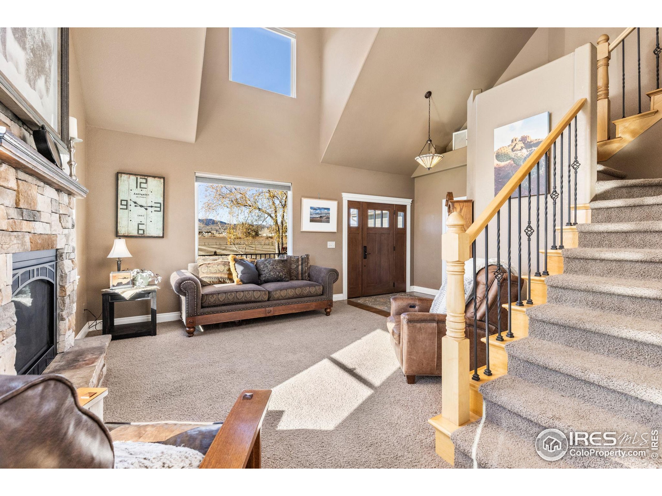 1822 Quarter Lane Berthoud, CO 80513 - Photo 13 of 49 a living room with furniture and a fireplace