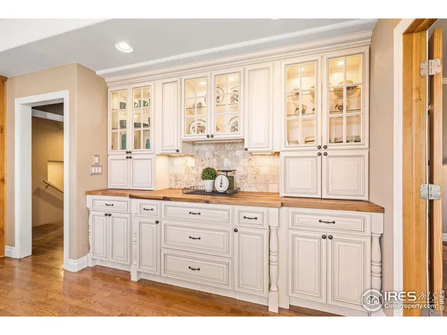 a view of a dining room with furniture wooden floor and chandelier