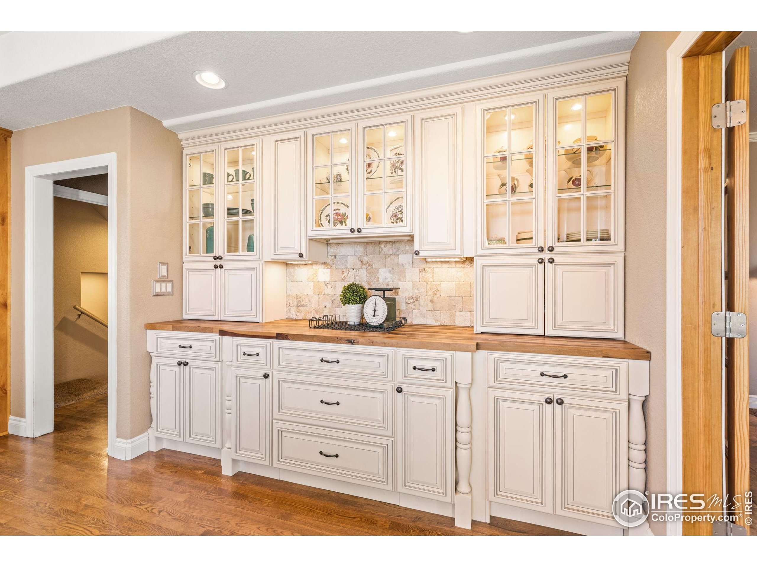1822 Quarter Lane Berthoud, CO 80513 - Photo 16 of 49 a kitchen with granite countertop a white cabinets and sink