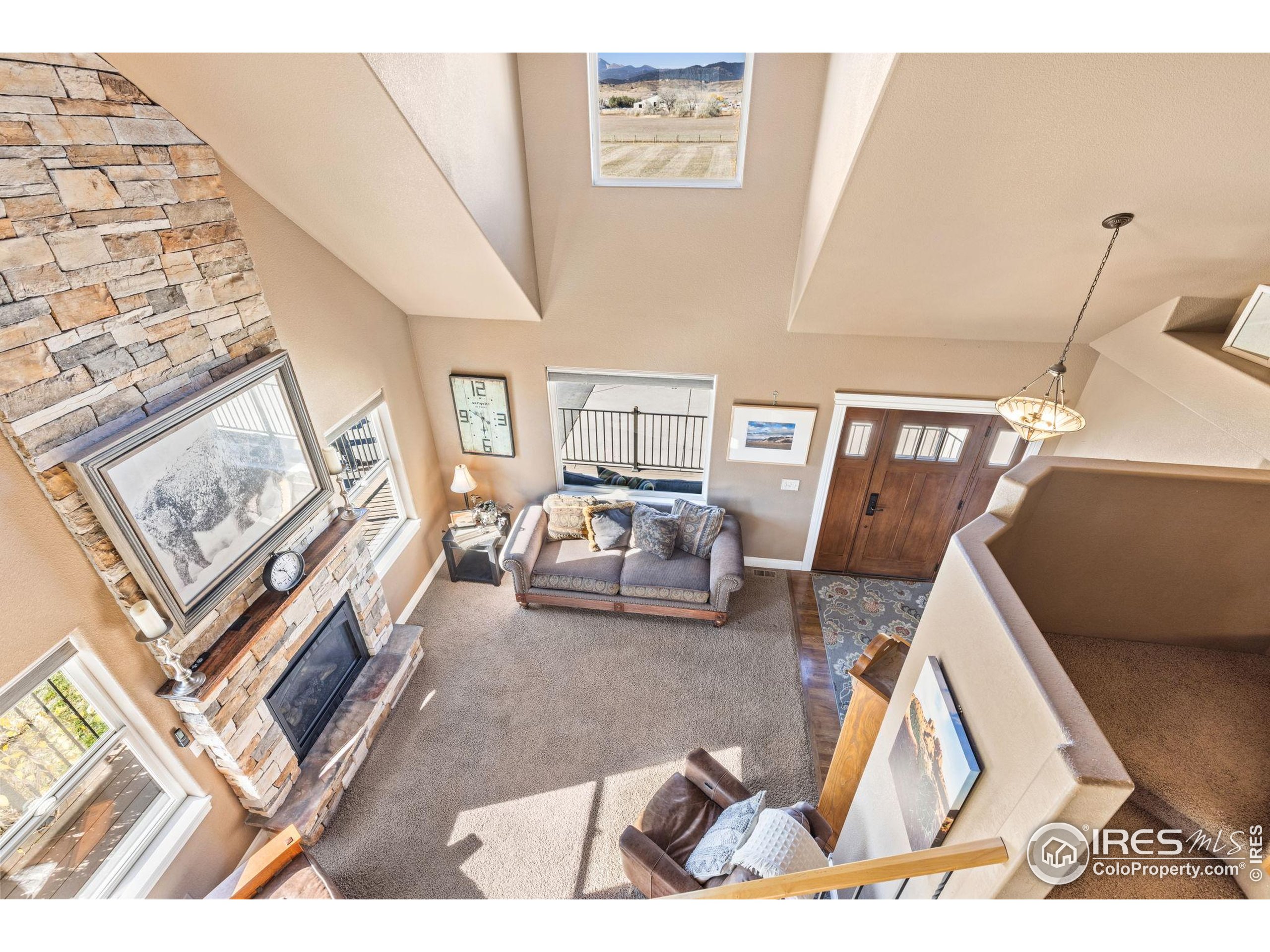 1822 Quarter Lane Berthoud, CO 80513 - Photo 23 of 49 a living room with furniture and a rug