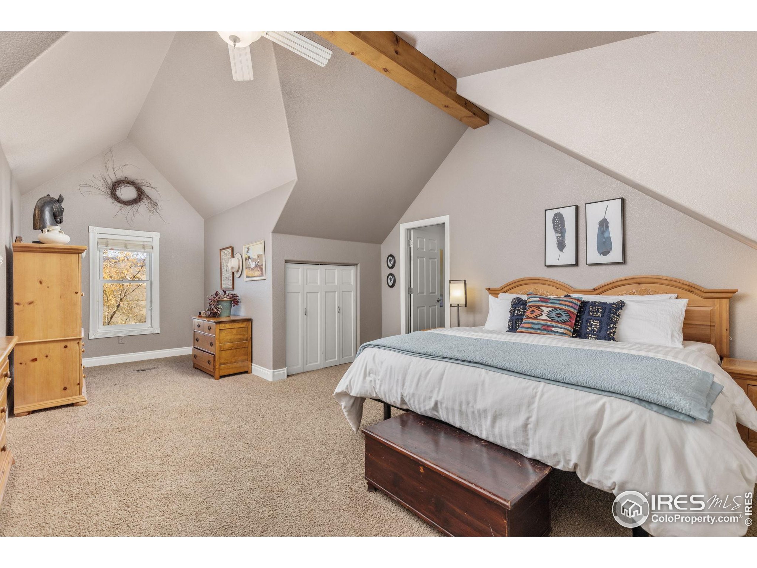 1822 Quarter Lane Berthoud, CO 80513 - Photo 25 of 49 a bedroom with bed and window