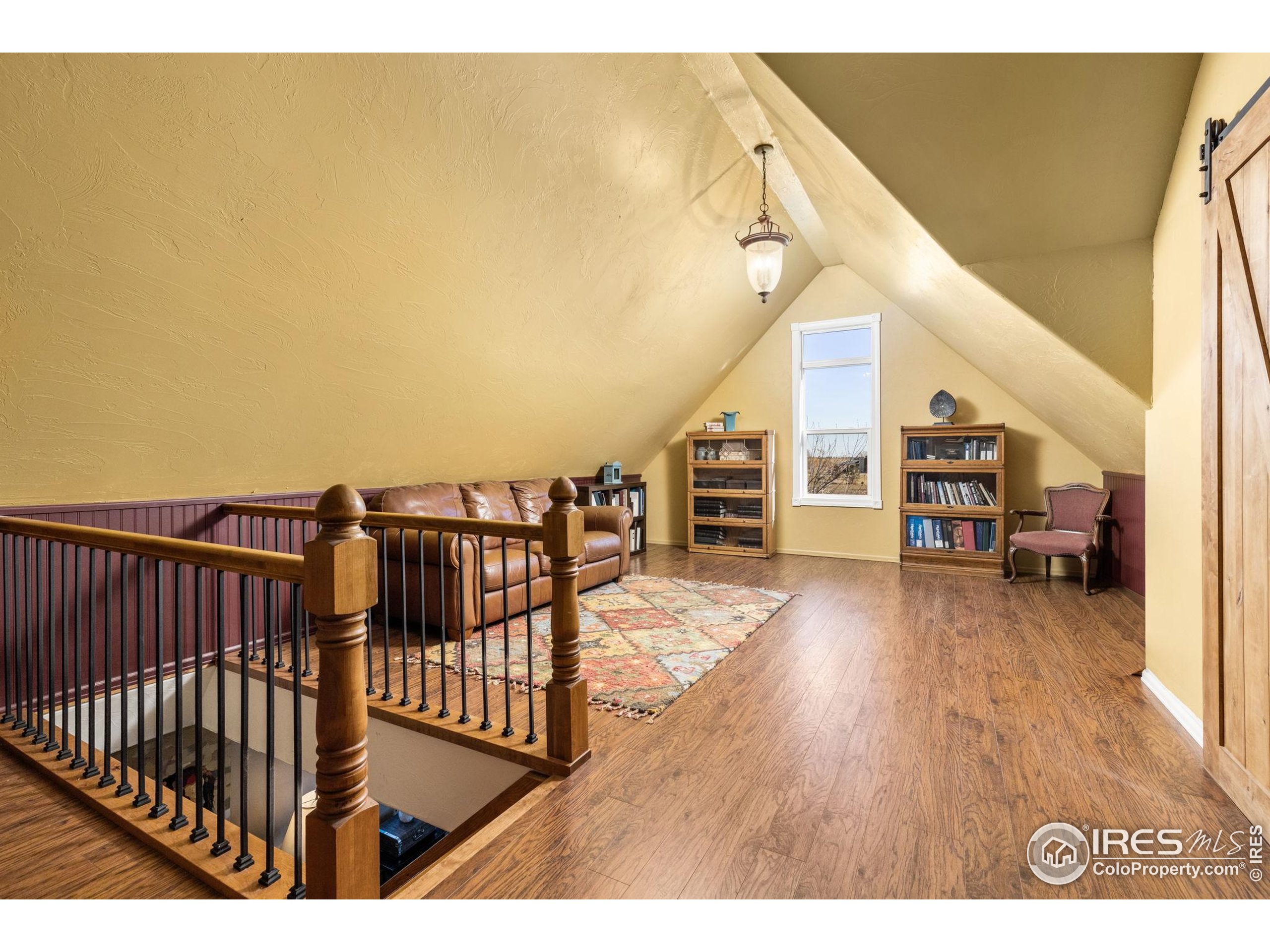 1822 Quarter Lane Berthoud, CO 80513 - Photo 27 of 49 a view of a balcony with furniture and wooden floor