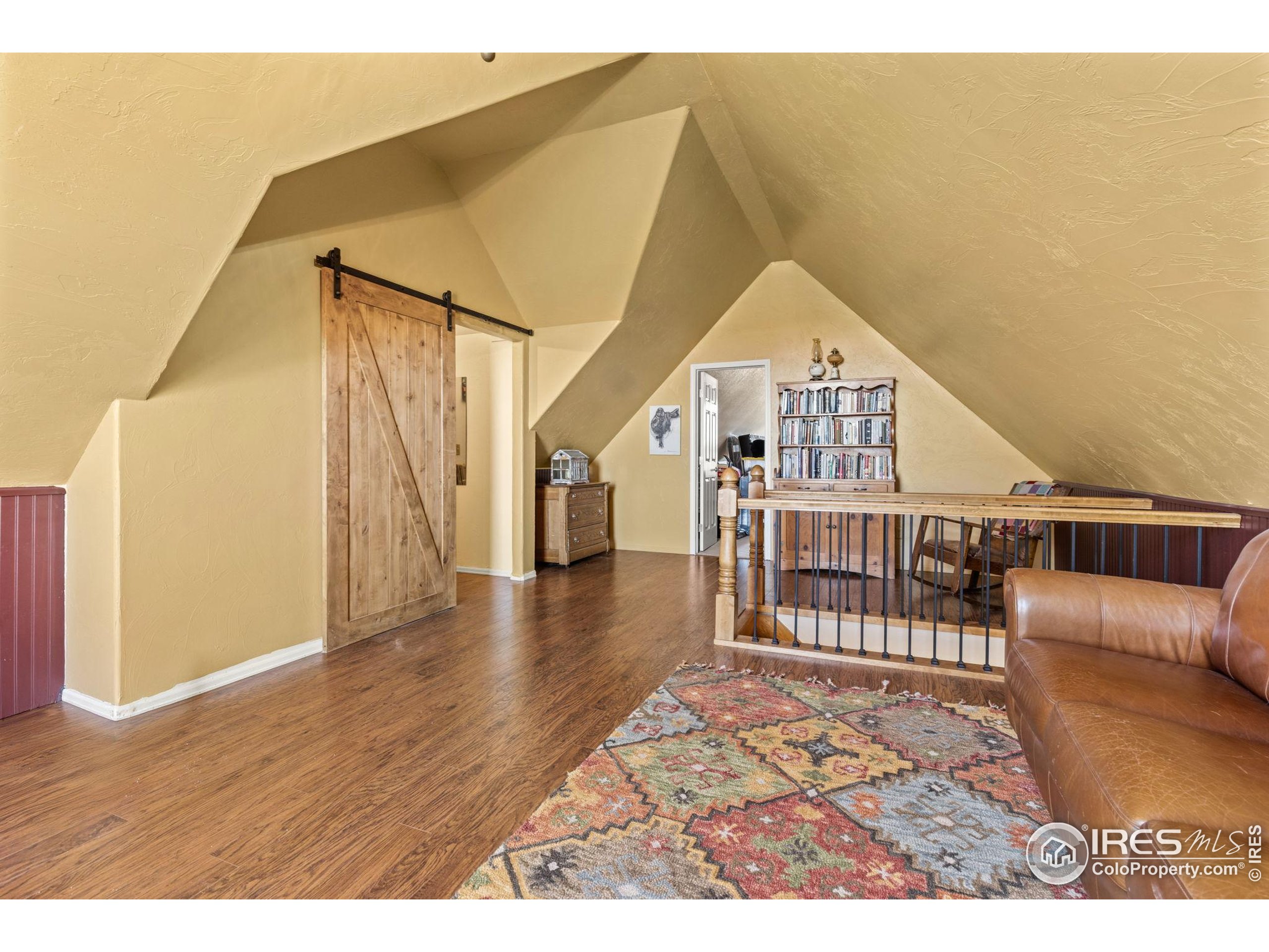 1822 Quarter Lane Berthoud, CO 80513 - Photo 28 of 49 a view of a livingroom with wooden floor and furniture