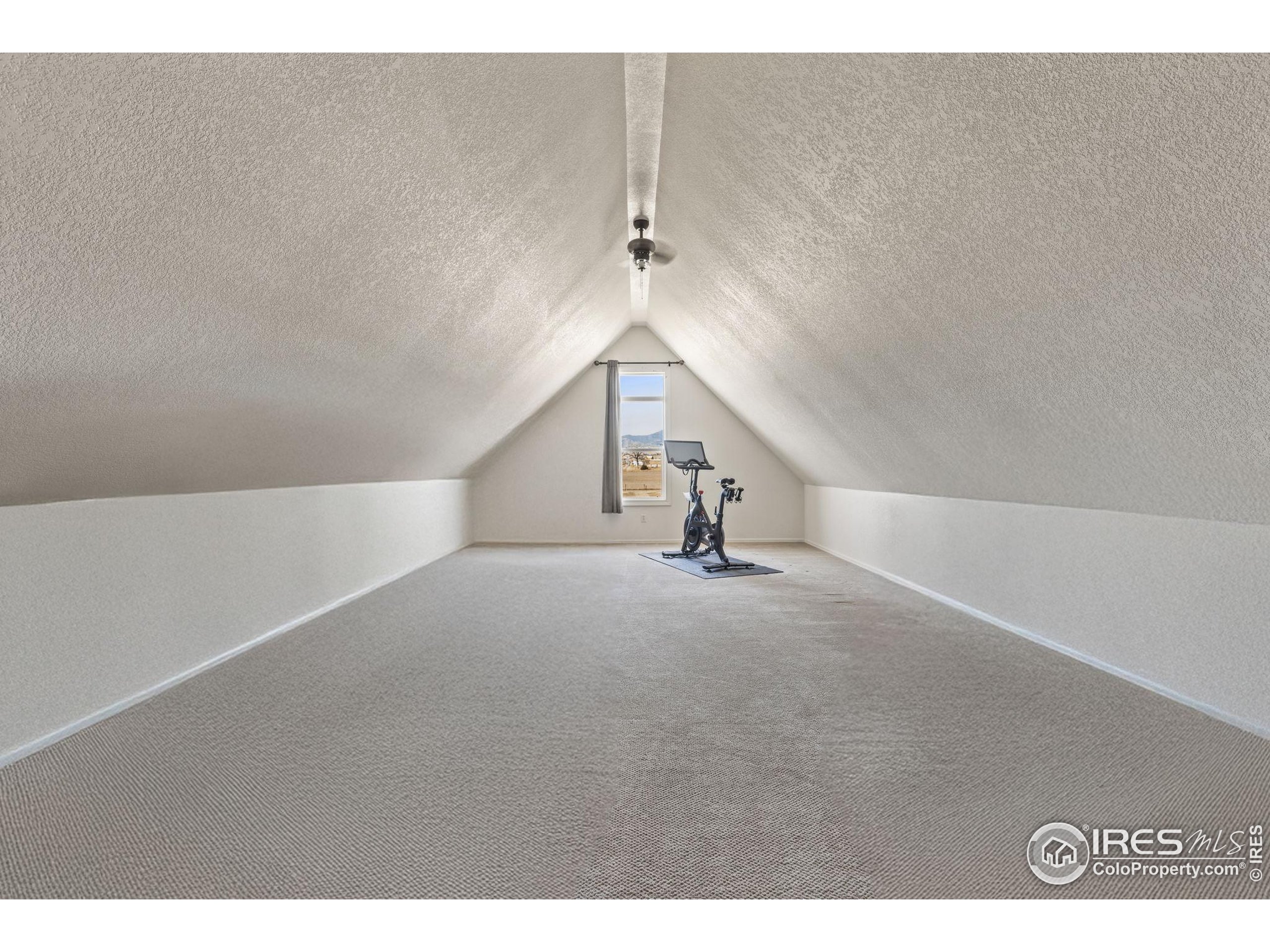 1822 Quarter Lane Berthoud, CO 80513 - Photo 29 of 49 a view of a livingroom with a staircase