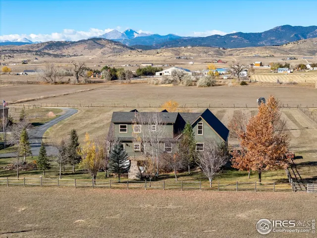 a view of a balcony with wooden floor and outdoor seating