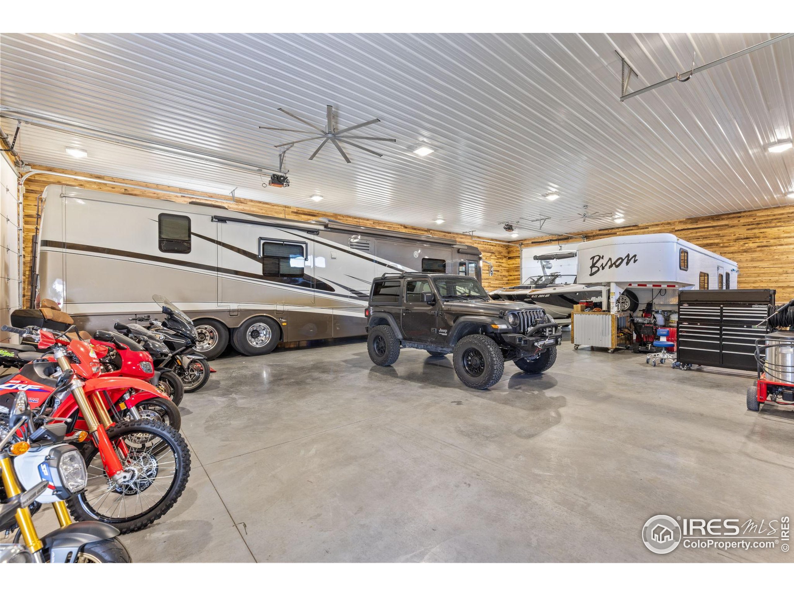 1822 Quarter Lane Berthoud, CO 80513 - Photo 6 of 49 a view of a garage with a bike and car