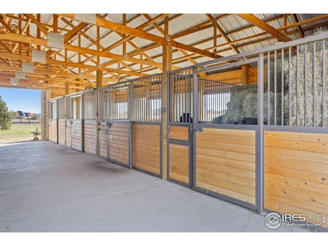 a view of house with outdoor space and parking