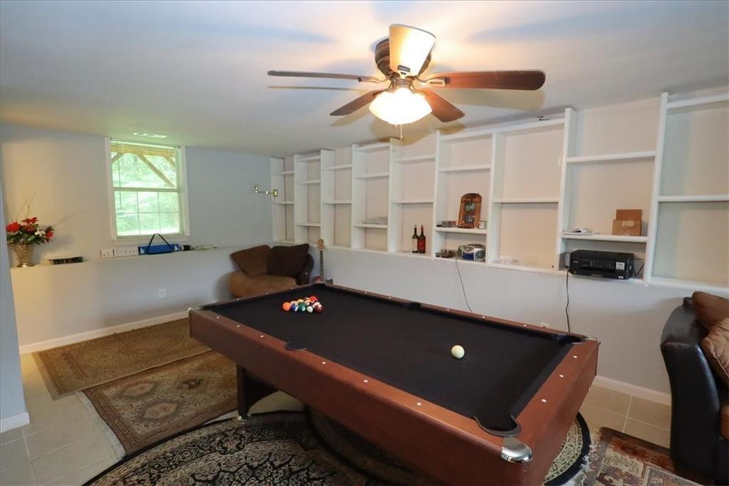 236 Hiram Sudie Road Dallas, GA 30157 - Photo 16 of 26 a living room with furniture and a table