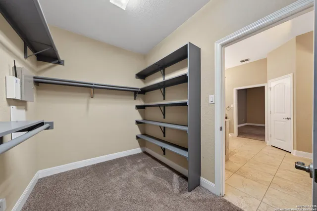 a view of an empty walk in closet