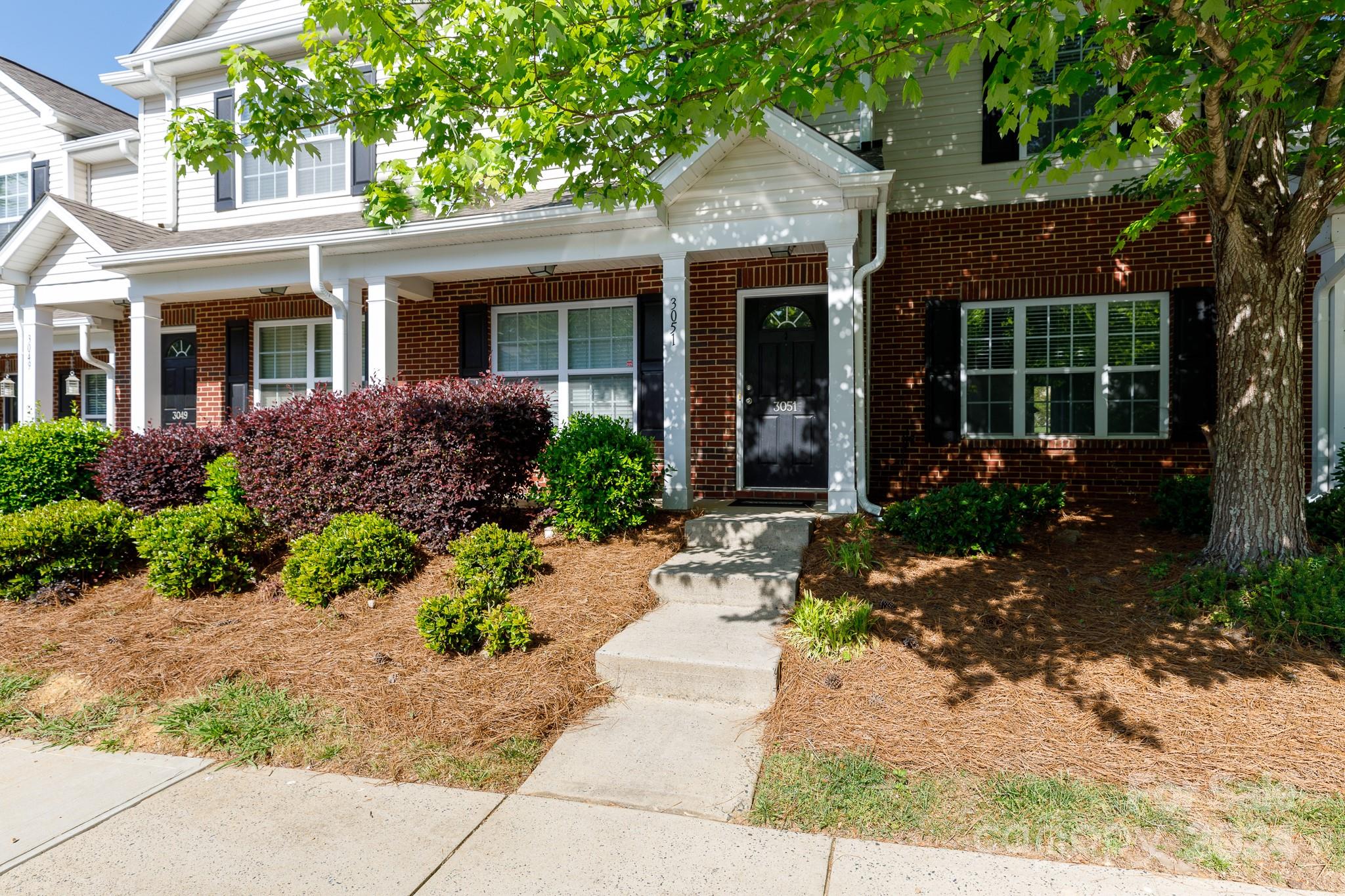 3051 Summerfield Ridge Lane Matthews, NC 28105 - Photo 1 of 23 front view of a house with a small yard