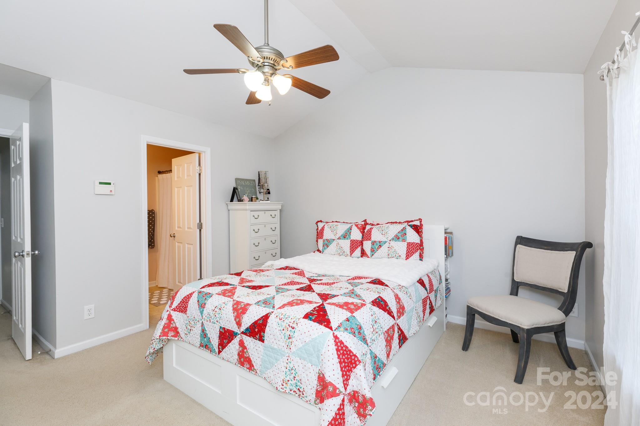 3051 Summerfield Ridge Lane Matthews, NC 28105 - Photo 12 of 23 a bedroom with a bed and a dresser in it