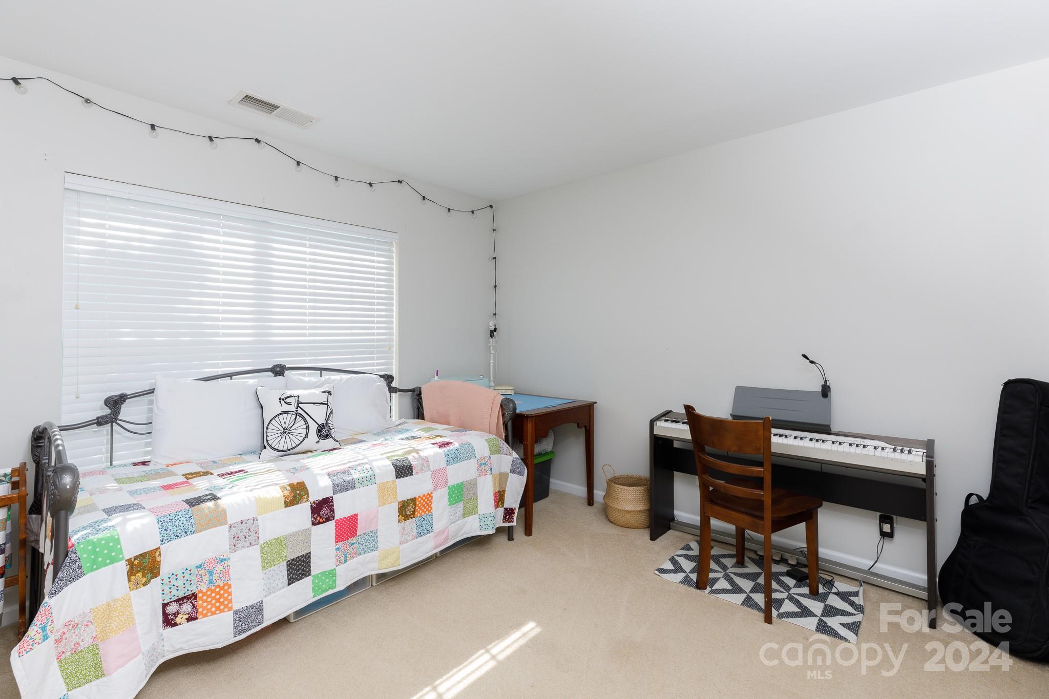 3051 Summerfield Ridge Lane Matthews, NC 28105 - Photo 15 of 23 a bedroom with a bed and a desk