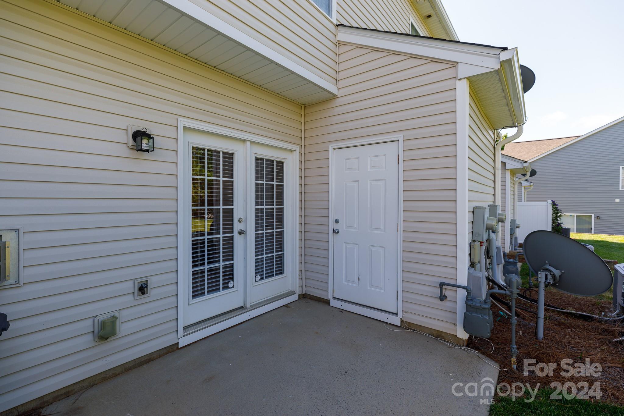 3051 Summerfield Ridge Lane Matthews, NC 28105 - Photo 20 of 23 a view of a patio with table and chairs and iron fence