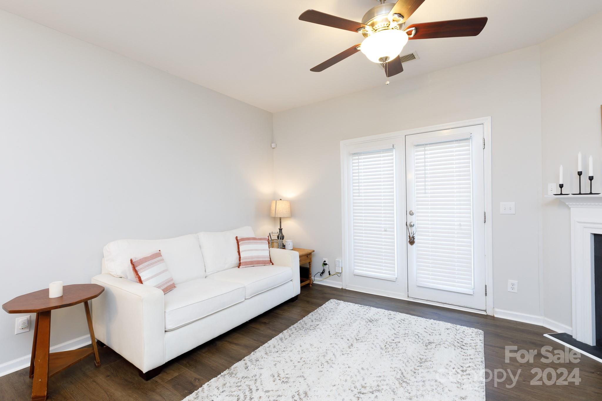 3051 Summerfield Ridge Lane Matthews, NC 28105 - Photo 2 of 23 a living room with furniture and a ceiling fan