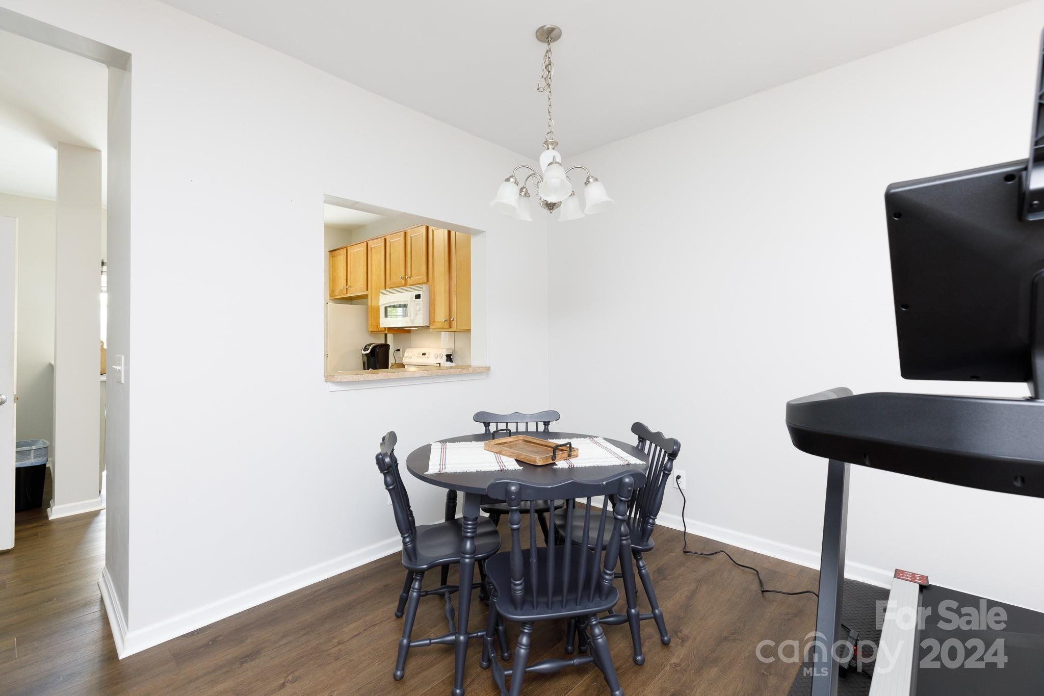 3051 Summerfield Ridge Lane Matthews, NC 28105 - Photo 4 of 23 a view of a dining room with furniture and wooden floor