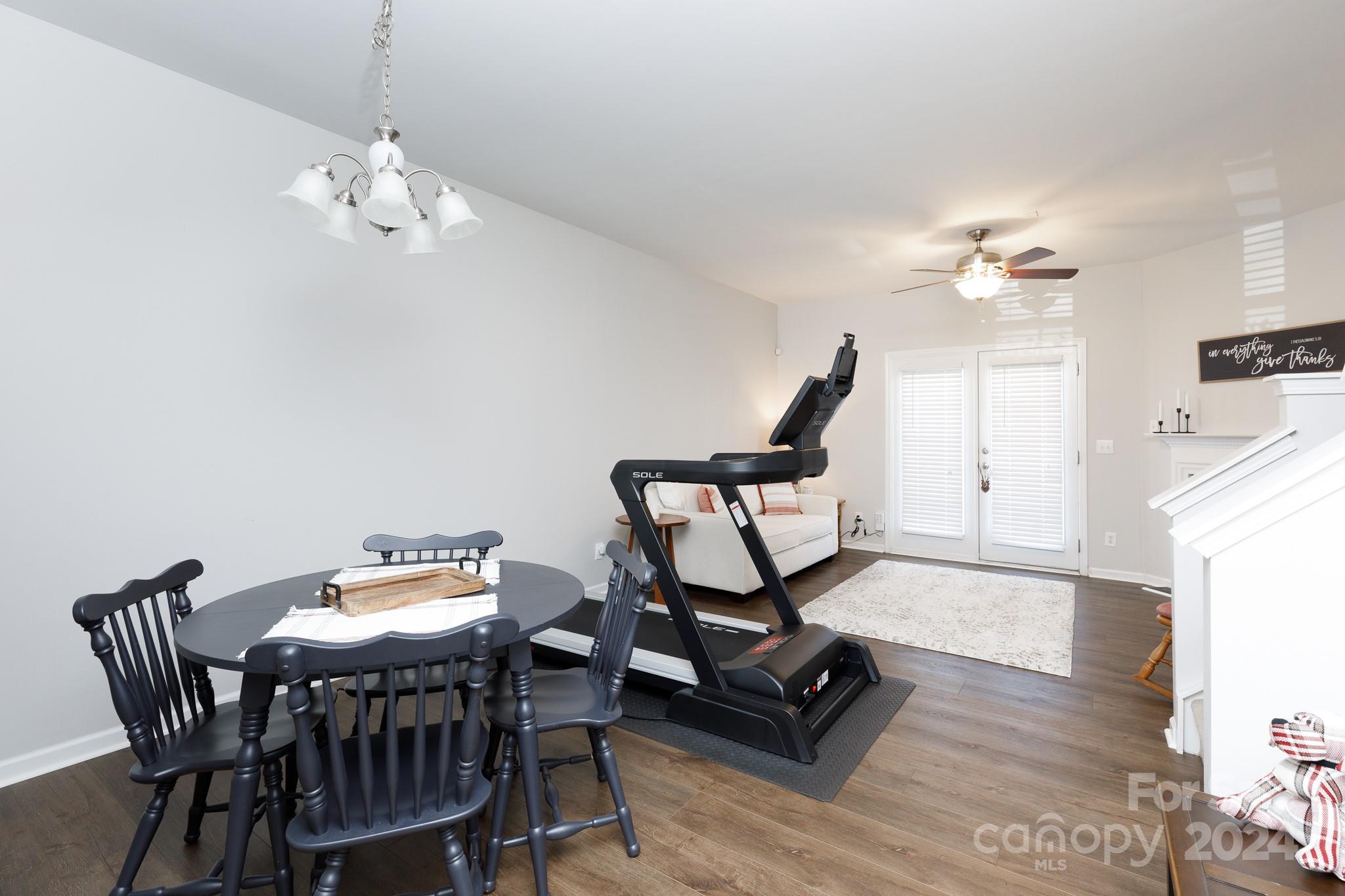 3051 Summerfield Ridge Lane Matthews, NC 28105 - Photo 5 of 23 a view of a dining room with furniture wooden floor and chandelier