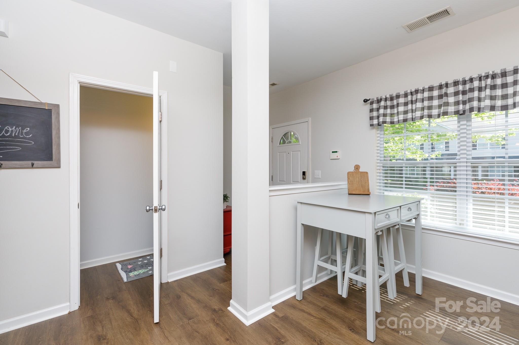 3051 Summerfield Ridge Lane Matthews, NC 28105 - Photo 8 of 23 a view of a workspace with furniture and a window