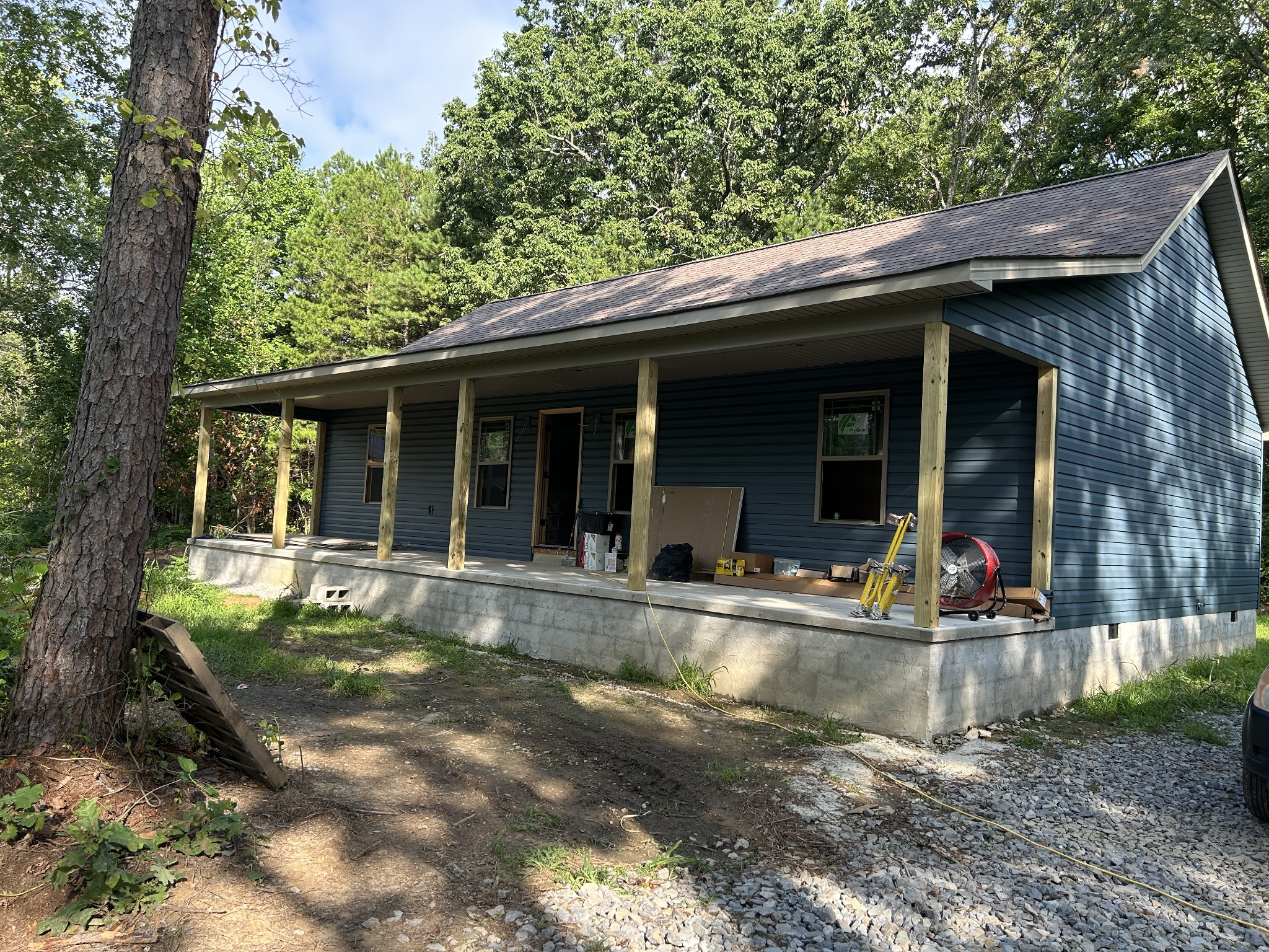 a view of house with a yard balcony