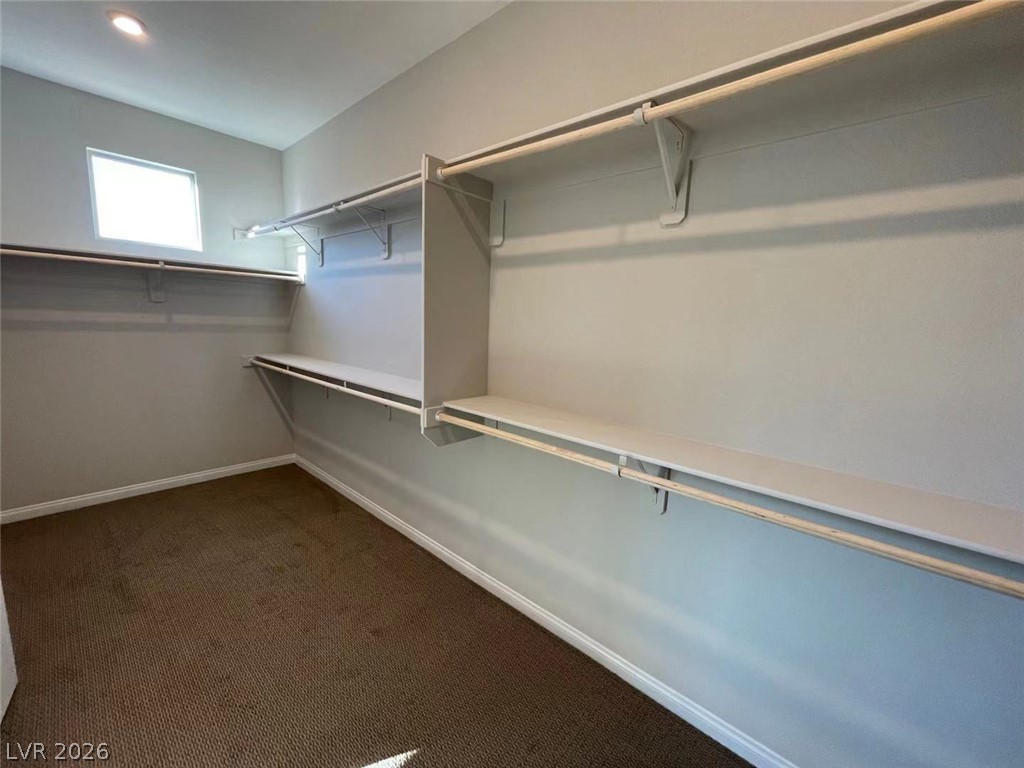 11 Rancho Maria Street Las Vegas, NV 89148 - Photo 17 of 27 An abundance of built-in shelving and hanging rods defines this large walk-in closet space.