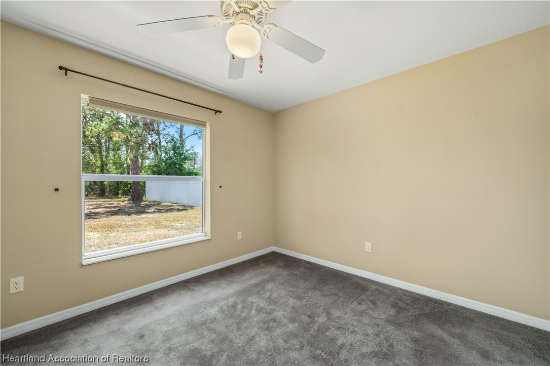 3519 Westminster Road Sebring, FL 33875 - Photo 18 of 31 an empty room with a window