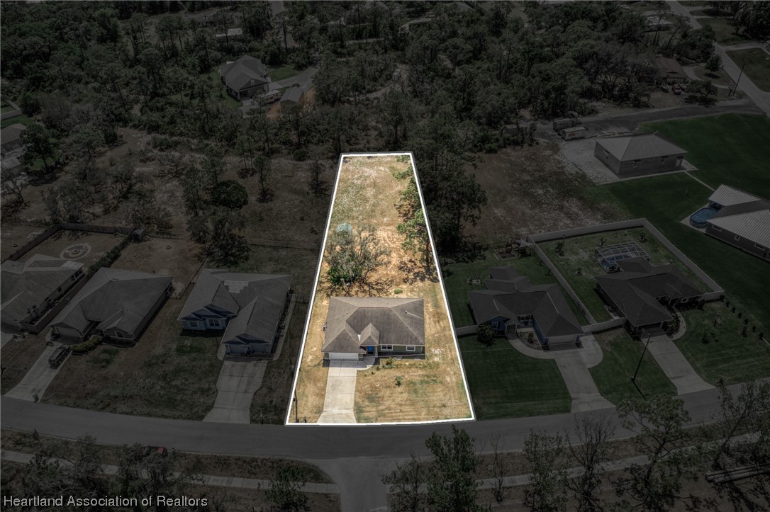 3519 Westminster Road Sebring, FL 33875 - Photo 2 of 31 an aerial view of a yard