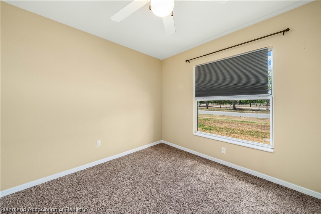 3519 Westminster Road Sebring, FL 33875 - Photo 23 of 31 a view of an empty room with window and tv