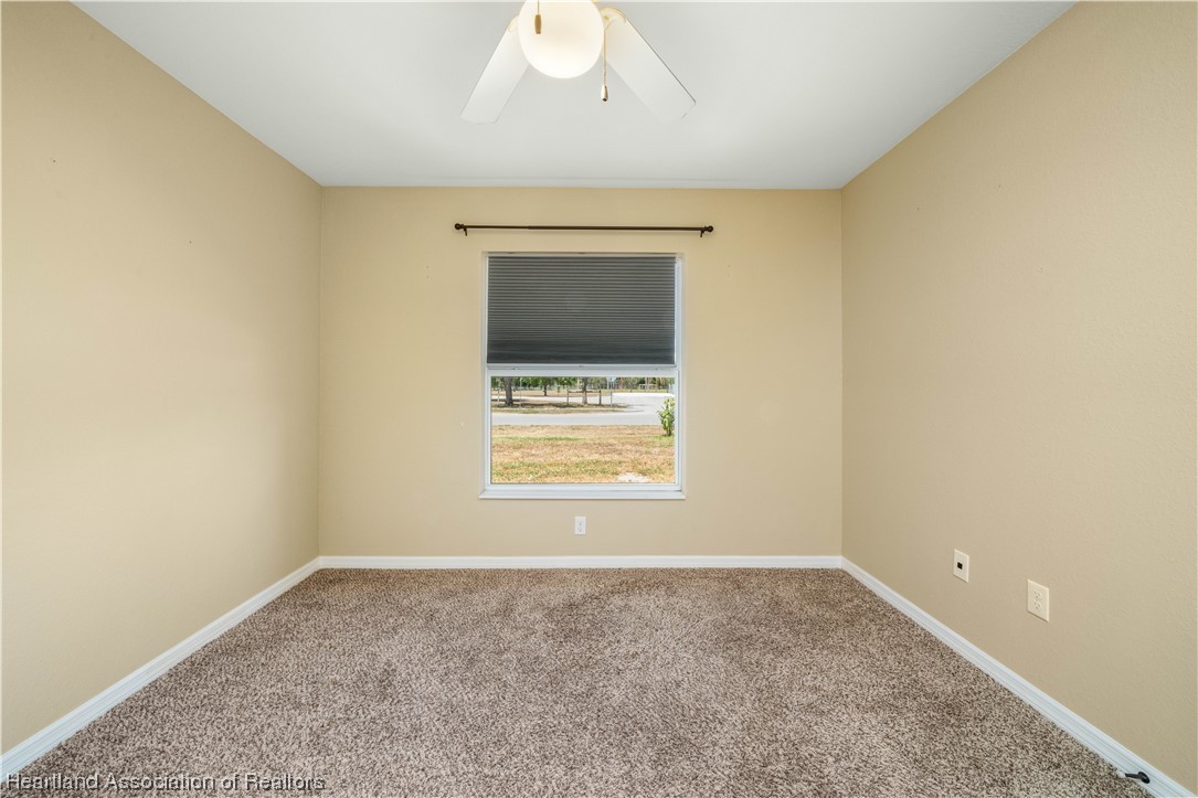 3519 Westminster Road Sebring, FL 33875 - Photo 24 of 31 a view of an empty room with a window